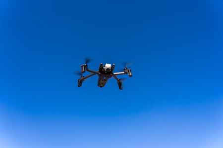 Drone flying in from of a clouds sky. High quality photo