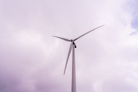 Wind turbine generating electricity clean energy with cloud and sunlight background on the sky. Clean energy concept. High quality photoの写真素材