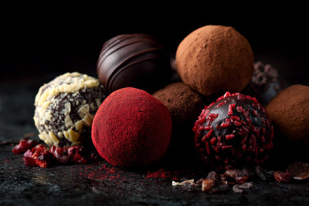 Luxury handmade decorative chocolate bonbon in a display of assorted pralines. AI Generative.の写真素材