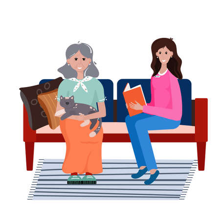 Volunteer takes care elderly woman. Social worker reads book old woman. Smiling young Lady sits in the sofa with grandma and read. Healthcare Vector flat cartoon illustration.のイラスト素材