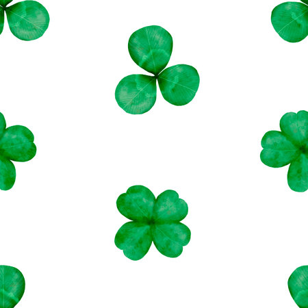 A festive pattern of Green Shamrocks, perfect for celebrating St. Patricks Dayの写真素材