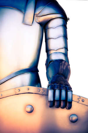 Knight in armor holding a shield in hand in vintage style on white background