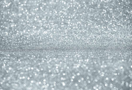 Glowing magic bokeh. Sparkling lights festive background with texture. Abstract Christmas twinkled bright bokeh defocused. Winter card or invitation. Holiday conceptの写真素材