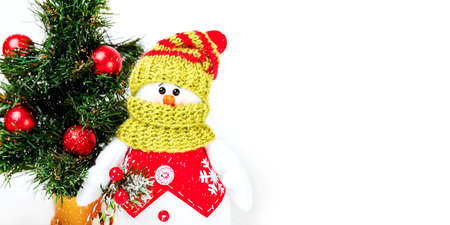 Snowman in snowy winter wonderland. Snowman on soft snow white background. Merry christmas and happy new year greeting card with copy space. Panoramic view of happy snowman in winter sceneryの写真素材