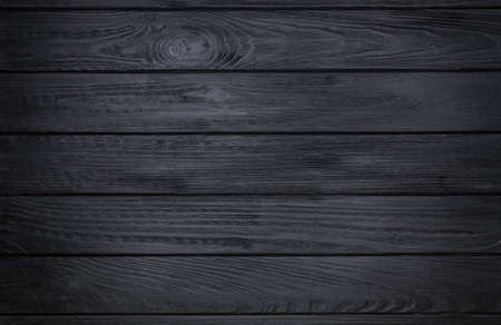 Black wooden background, old wooden planks texture. Black wood oak table. Dark walnut color wooden...