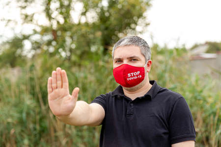 Panic and home isolation due to coronavirus outbreak. Young man in protective face mask. Human...