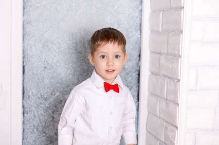 Happy boy present birthday gift to mom. Holidays, celebration at home. Funny kid congratulate mother...