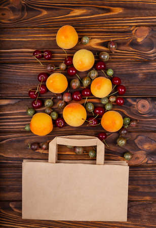 Composition with shopping bag and products. Online grocery healthy food shopping in paper bag. The concept of online shopping, plastic free. Flat lay of paper bag and different healthy food.の写真素材