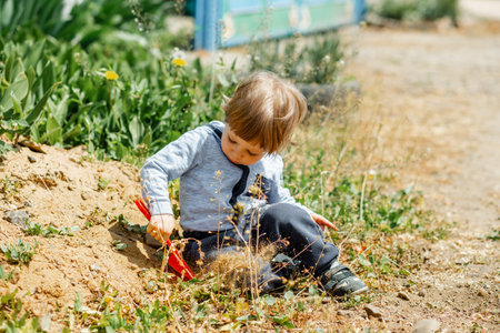 Healthy carefree kid playing outside. Happy child playing in the sun. Freedom concept. Funny child have great time in summer. Happy boy smiling on nature background. Happy and health childhood.の写真素材