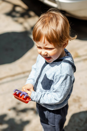 Funny child have great time in summer. Happy boy smiling on nature background. Happiness, childhood and freedom concept. Little boy standing outside. Little boy relax outdoors. Freedom concept.の写真素材
