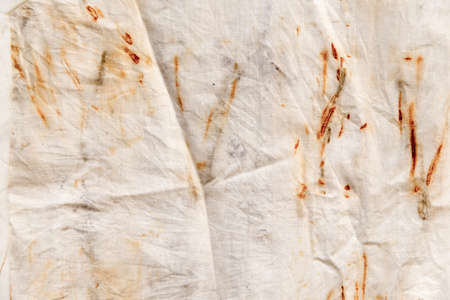 The texture of an old linen cloth, covered with dirt and rust. Background grangeの写真素材