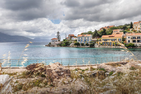 Fiskardo village on the Ionian Island of Kefalonia Greece, summer vacation destination, cloudy sky and beautiful landscape scenery.の写真素材