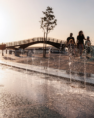 Romantic sunset in Lefkada or Lefkas Greek island, Ionian Sea near Preveza. People silhouette on the bridge, summer vacation.の写真素材