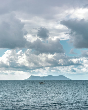 Cruise on Lefkada or Lefkas Greek island, Ionian Sea near Preveza. Summer vacation. Cloudy sky and waves.の写真素材