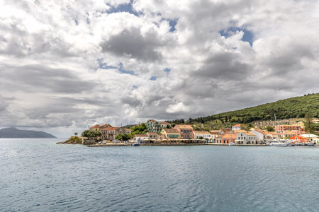Fiskardo village on the Ionian Island of Kefalonia Greece, summer vacation destination, cloudy sky and beautiful landscape scenery.の写真素材