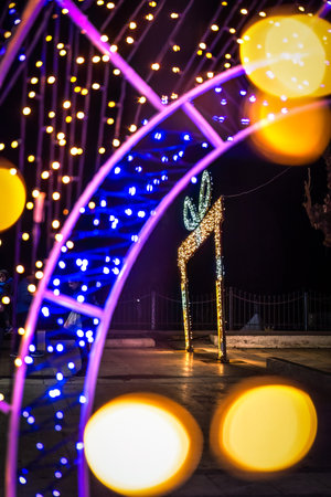 Lighthouse and fountain in Alexandroupolis Evros region Greece, Christmas and New Year decoration, vibrant colors and lights, touristic destination.の写真素材