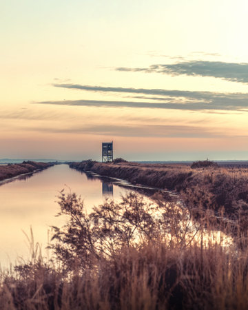 Sunset or sunrise on National park of Evros Delta, near Alexandroupolis Greece, bird observatory reflection.の写真素材