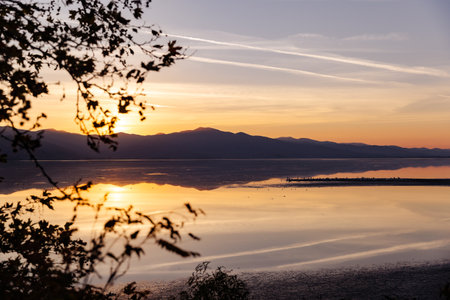 Beautiful sunset scenery on Kerkini lake Macedonia Greece, golden hour and sunrise, water reflection, autumn leaves.の写真素材