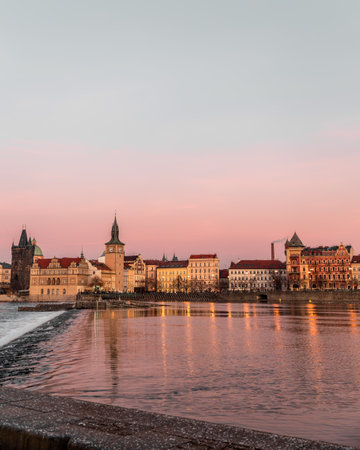 Sunset colors in Prague Historical Gothic Medieval castle, St. Vitus Cathedral, Charles Bridge and river Vltava boat cruise, astronomical clock, Unesco city tourism, golden hour and water reflection.の写真素材