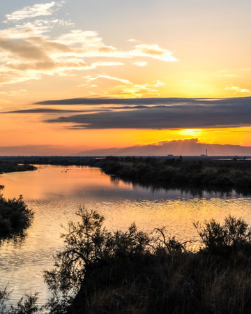Beautiful sunset or sunrise on the wetland National Park Delta Evros in Thrace Greece near to Feres and Alexandroupolis, near Greek Turkish borders, panoramic view.の写真素材