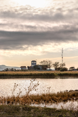 Beautiful sunset or sunrise on the wetland National Park Delta Evros in Thrace Greece near to Feres and Alexandroupolis, near Greek Turkish borders, panoramic view.の写真素材