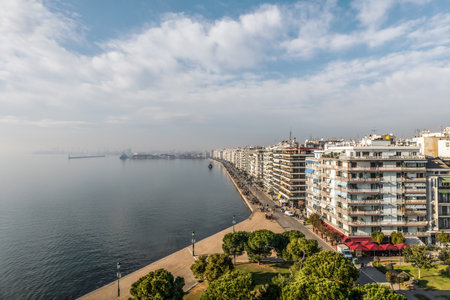 Panoramic view from White Tower monument and museum in Thessaloniki or Saloniki capital of Macedonia Greece, walking pedestrians, major seaport, blue sky.の写真素材