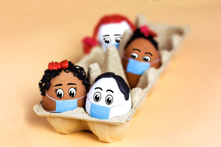 Easter eggs white and brown DIY,   virus protection Concepts and different skin colorsの写真素材