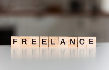 word freelance Wooden blocks with lettering on the background of the kitchen interior Human Resource Management and Recruitment and Hiring conceptの写真素材