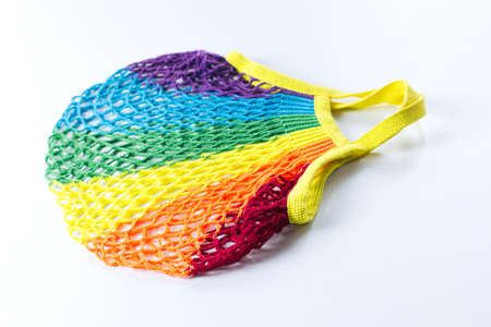 Reusable cotton shopping bag, multicolored rainbow LGBT trending colors. On a light gray background. The concept of zero waste, no plasticの写真素材