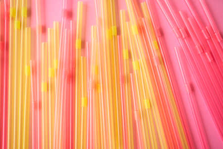 Bright multicolor background made with plastic straws.