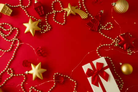 Christmas composition with gold and red decorations.