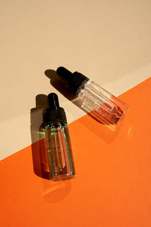 Essential oils on the trendy geometric backgroundの写真素材