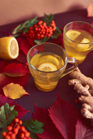 Autumnal composition with two cups of ginger tea