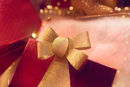 Christmas decorations and present boxes with festive lightsの写真素材