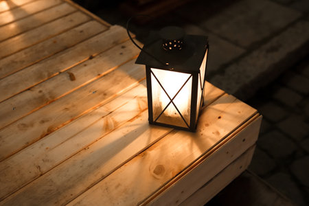 Christmas lantern on the wooden table. New Year and Christmas decorations