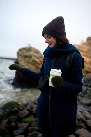 Beautiful caucasian woman walking by the sea