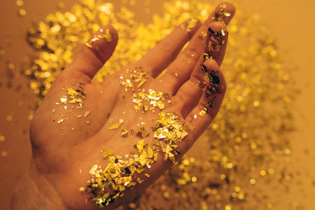 Hand in glitter. creative process