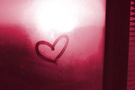 Valentines day, love symbol, heart on the misty window. Color of the year 2023 - Viva Magentaの写真素材