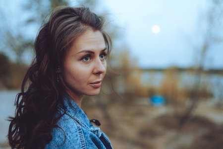 Portrait of a beautiful caucasian woman in the eveningの写真素材