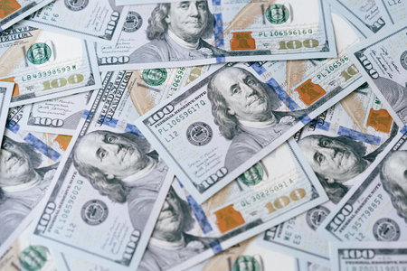 Pile of US One Hundred Dollar Bills Representing Wealth and Financial Successの写真素材