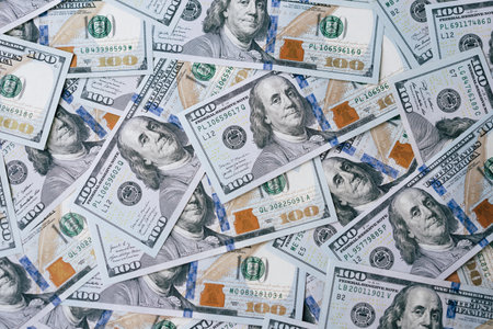 Pile of US One Hundred Dollar Bills Representing Wealth and Financial Successの写真素材