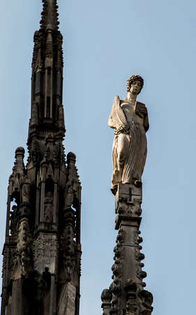 Duomo di Milano, Milan july 2018. Statue on the roof of the Duomo.の写真素材