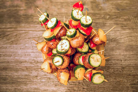ready for cooking vegetables and mushroom vegetarian and vegan kebabs on skewers with spices and...
