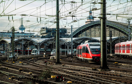 Cologne, Germany, February 22, 2019 . Modern ed locomotive ans train standing at a train station in...