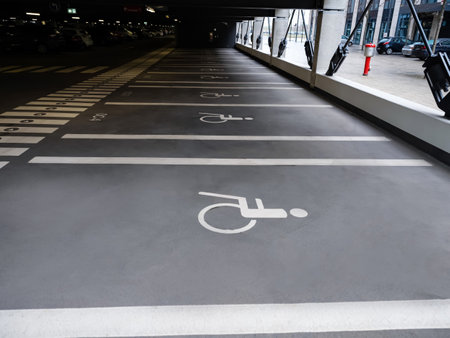 Berlin Branderburg,Germany 26 December 2020 places for disabled people in parking garage with cars and many lights at the new Berlin Branderburg Willy Brandt Airportのeditorial素材