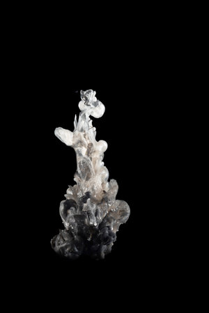 black and gold Acrylic colors ink in water isolated Abstract and bright. subject photo, cosmetics, drinks and advertising concept.の写真素材