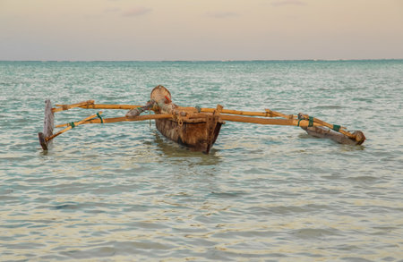 Traditional african vintage fishing hand made sail boat in ocean close up. travel concept