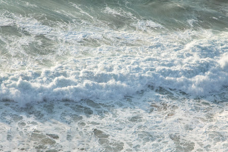 Beautiful sea waves with foam blue and turquoise. Nature background and travel concept