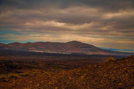 Amazing panoramic landscape of volcano in Timanfaya national park. Popular touristic in Lanzarote island Canary islands Spain. Artistic picture. Travel concept.の写真素材