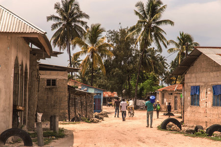 Zanzibar, Tanzania. 27 March 2018. traditional African road through the village and people going about their businessの写真素材
